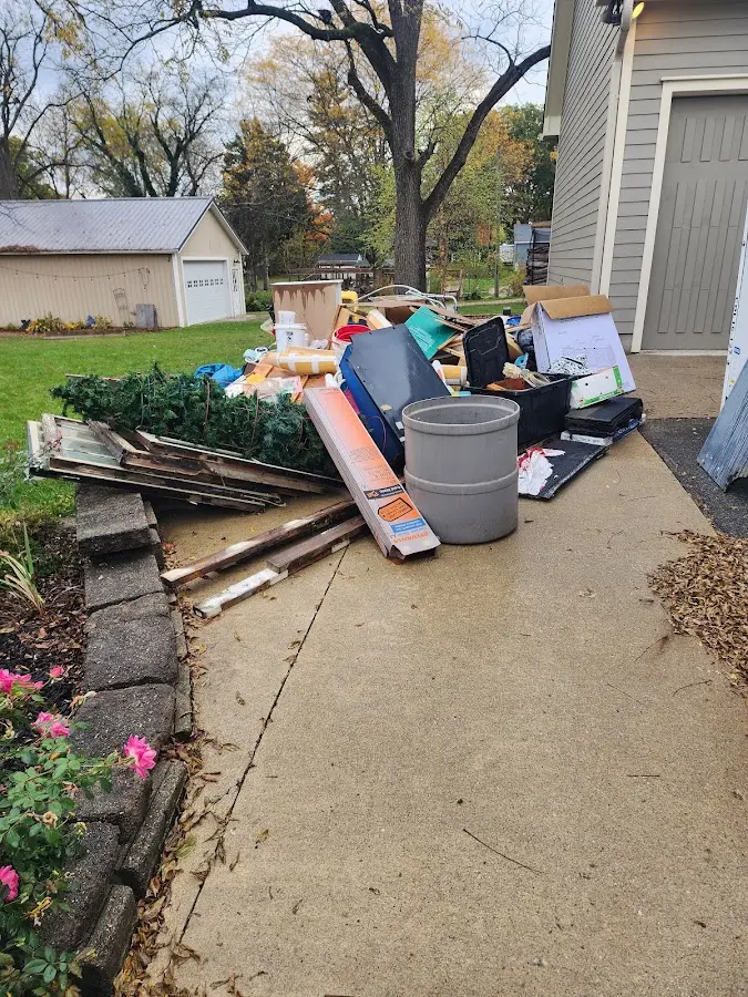 Dumpster being loaded with debris for Commercial Dumpster Rental in Adairsville